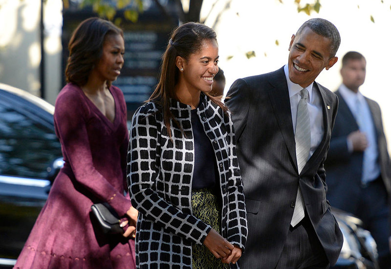 First lady Michelle Obama, daughter Malia Obama and President Barack Obama walk from St. John’s Church to the White House after service Oct. 27, 2013. Shawn Thew-Pool/Getty Images